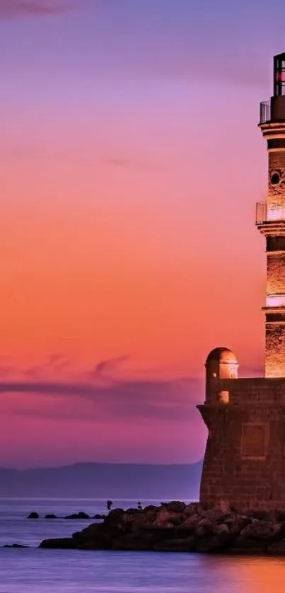 Lighthouse at sunset with vibrant purple sky.