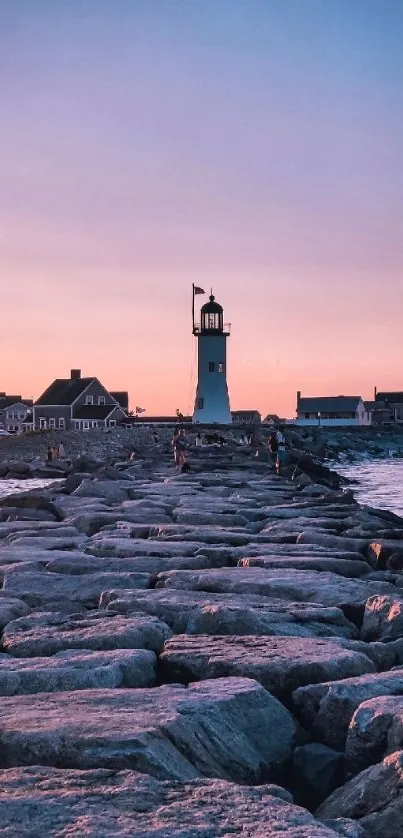 Lighthouse at sunset with rocky path and ocean view in warm tones.