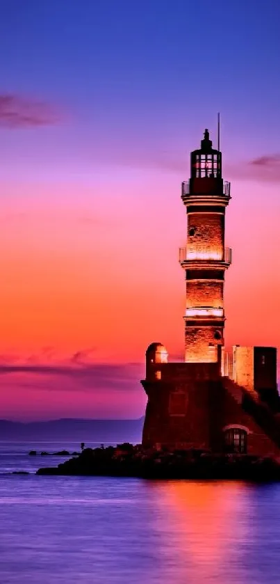 A serene lighthouse silhouette at vibrant sunset over calm ocean waters.