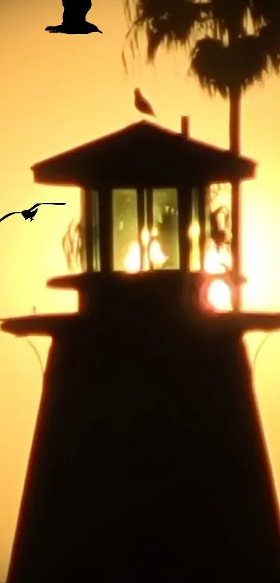 Lighthouse silhouette with sunset sky and flying birds.