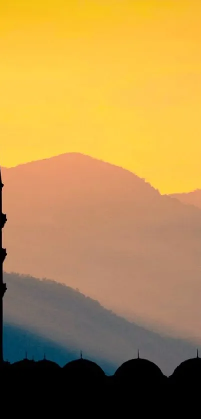 Silhouette of mosque and figure praying at sunset.