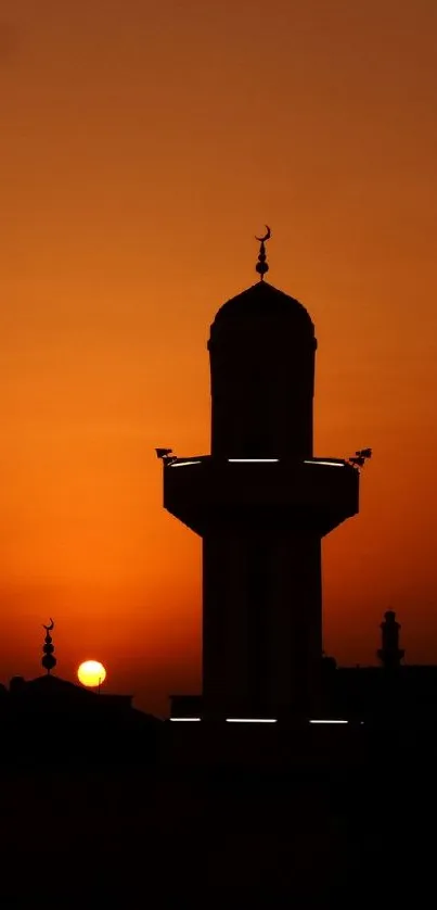 Silhouette of a mosque at sunset against an orange sky, ideal for phone wallpaper.