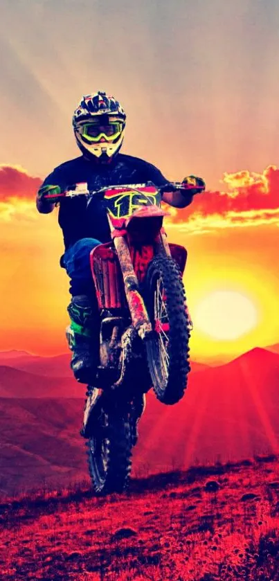 Motocross rider in sunset landscape with vibrant orange hues.