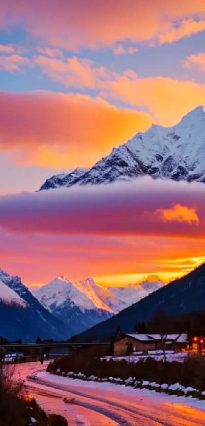 Stunning sunset over snowy mountain peaks with vibrant evening sky.