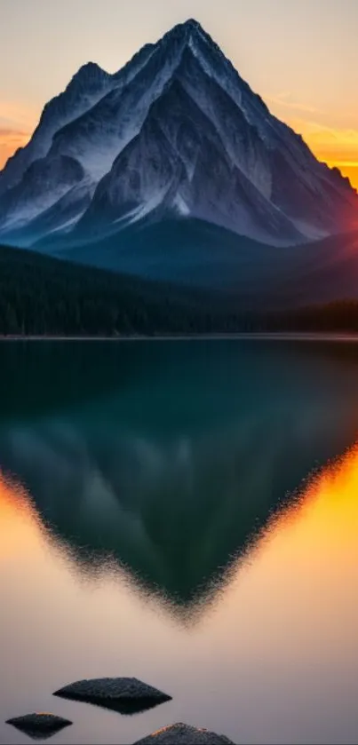 Majestic mountain reflected in lake with sunset glow.