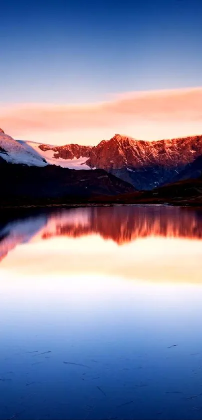 Serene sunset reflection on a mountain lake wallpaper.