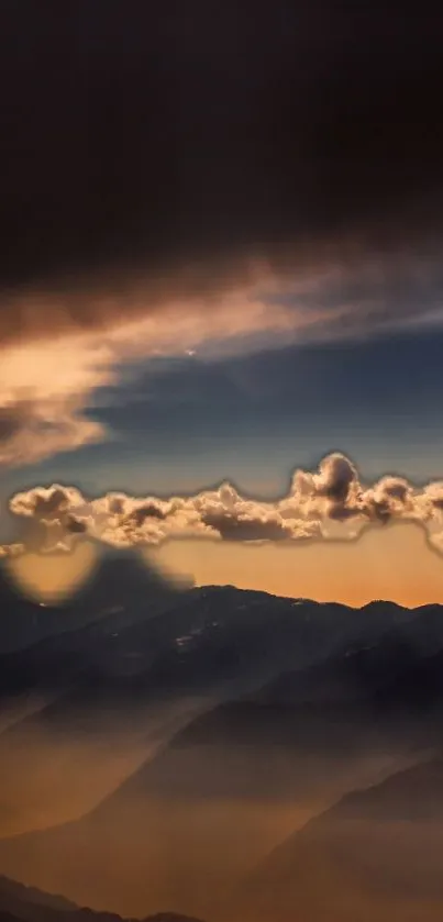 Dramatic sunset sky with mountains and clouds.