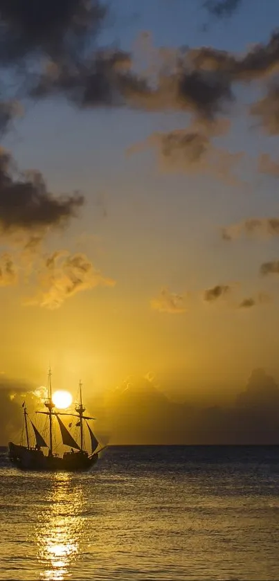 Silhouette of a ship against a golden sunset over the ocean.