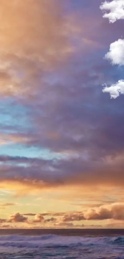 Vibrant sunset over ocean with clouds in the sky.