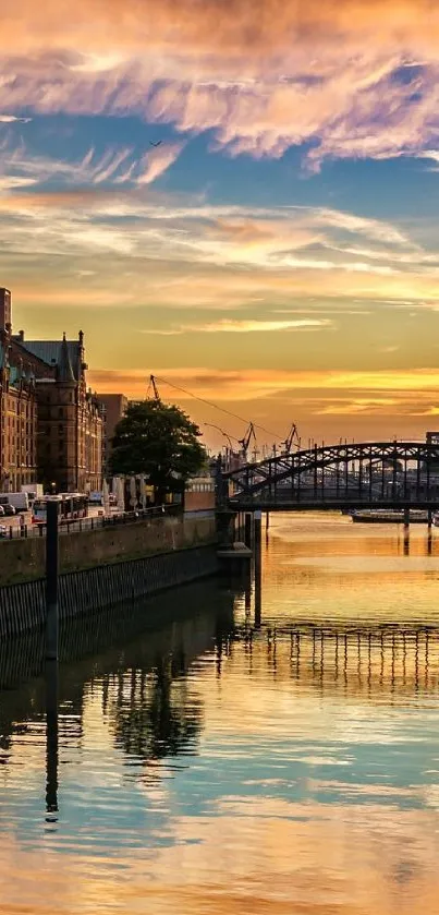 Scenic sunset view over a city canal with vibrant sky reflection.