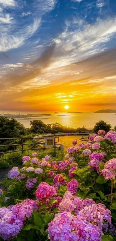 Tranquil sunset over a vibrant field of blooming pink flowers and an orange sky.