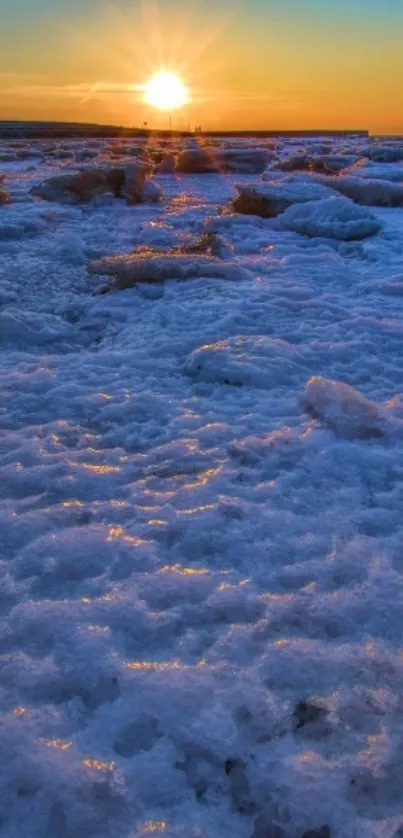 Sunset over a frozen, icy landscape with a warm glow.