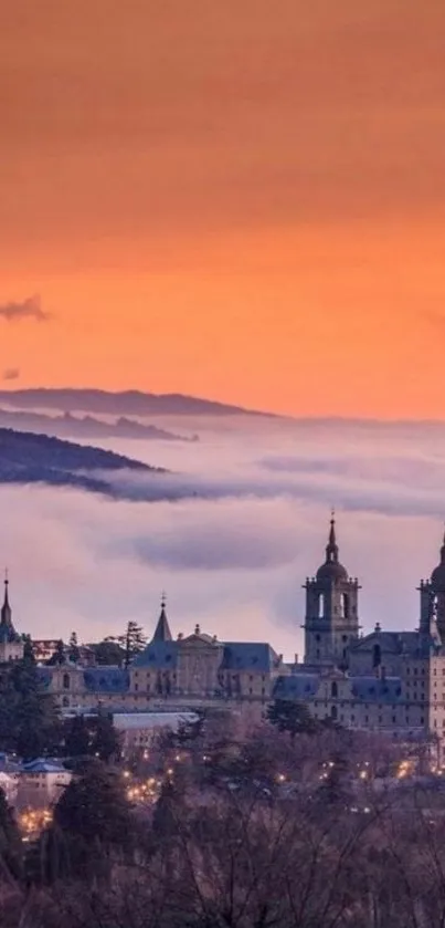 Orange sunset over historic city with cloudy hills.