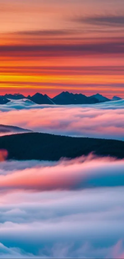 Sunset over misty mountains with vibrant clouds.