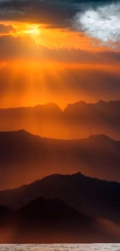 Golden sunset over mountain peaks casting warm, tranquil rays.