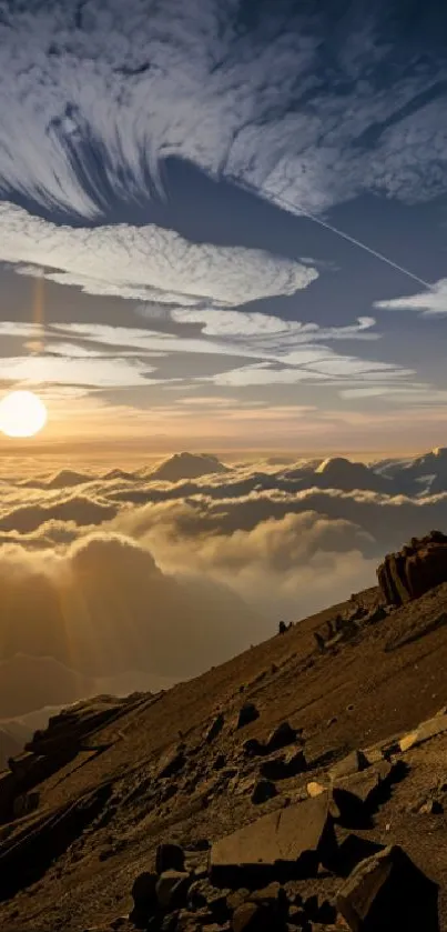 Beautiful sunset over mountainous landscape with glowing sun and dramatic clouds.