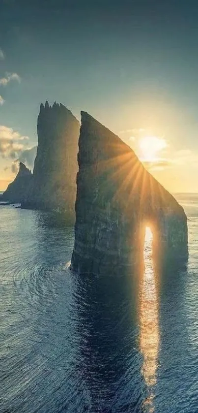 Stunning sunset over ocean cliffs with sun rays reflecting on the water.