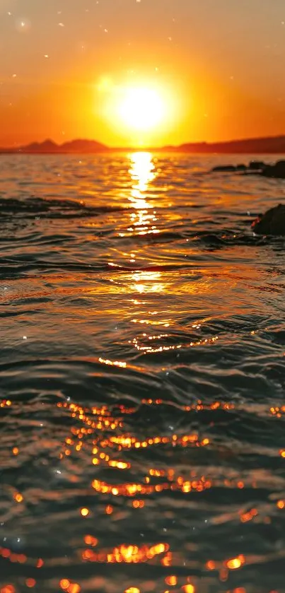 Vibrant ocean sunset with warm glowing hues over waves.