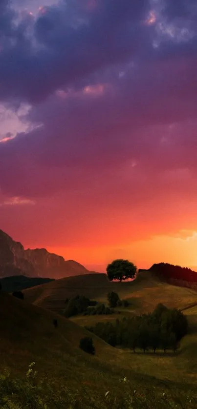 Sunset over rolling hills with a purple and orange sky, serene landscape view.