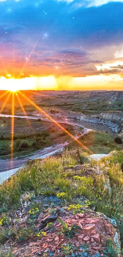 Vibrant sunset over a scenic valley with a winding river.