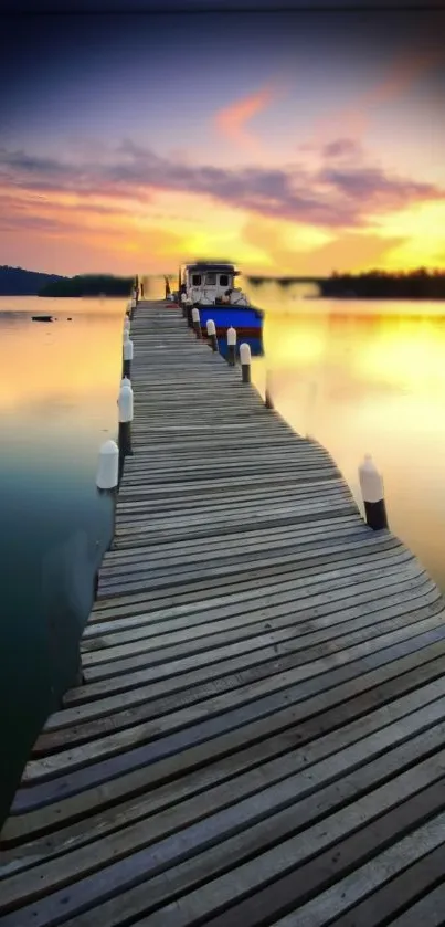 Serene pier at sunset with vibrant sky and calm waters.