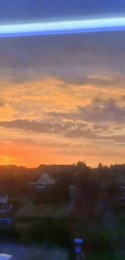 Sunset view over a quiet townscape with orange clouds.