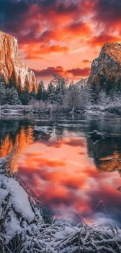 Crimson sunset over snowy mountains and reflective lake.