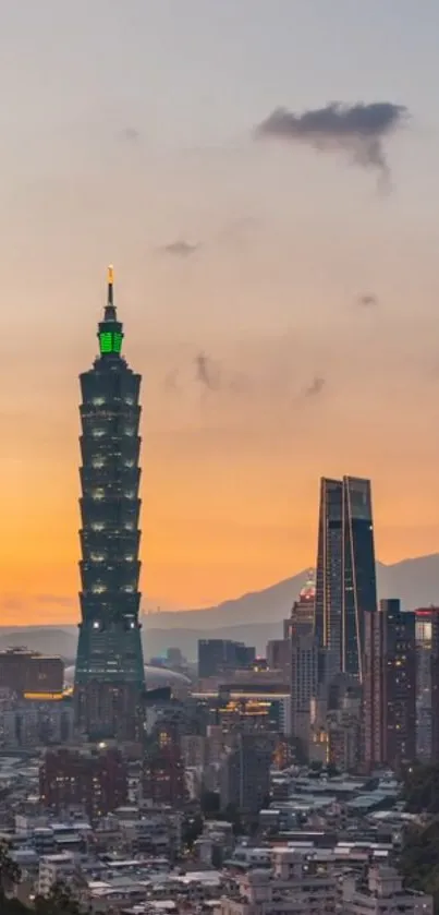 Taipei skyline at sunset with Taipei 101 against an orange sky.