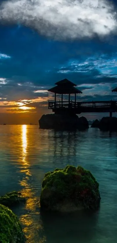 Tranquil ocean sunset with silhouette gazebos and reflections.