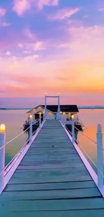 Serene pier with colorful sunset reflected in calm waters.