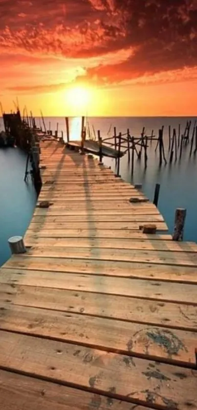 Sunset over a wooden pier with vibrant orange and calm blue hues.