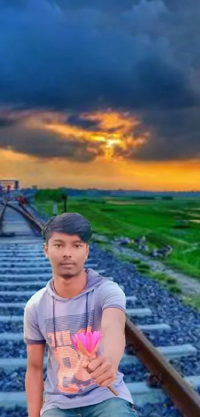 Serene railway track at sunset with vibrant sky and lush greenery.