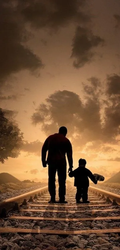 Father and child walking on railroad tracks at sunset.