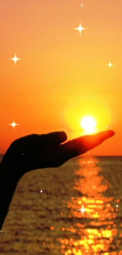 Hand holds the sun at sunset reflecting over the ocean with twinkling stars.