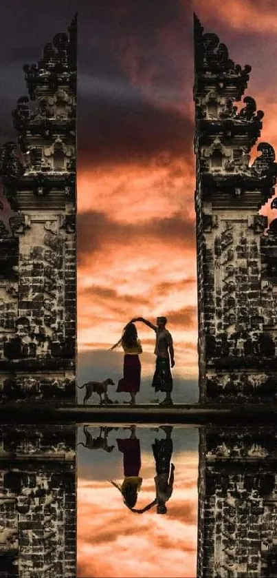 Lempuyang Temple gates reflecting sunset sky in Bali, with vivid fiery colors.