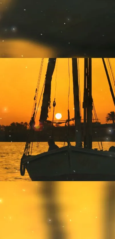 Sailboat silhouette against an orange sunset.