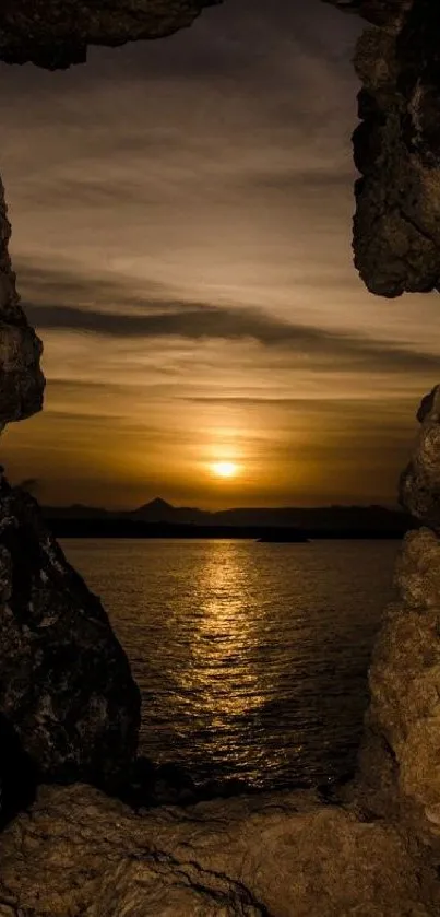 Stunning sunset seen through a rocky frame over the ocean.