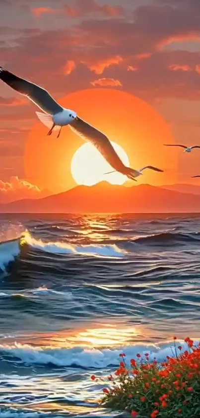 Seagulls flying over an ocean with a vibrant sunset.