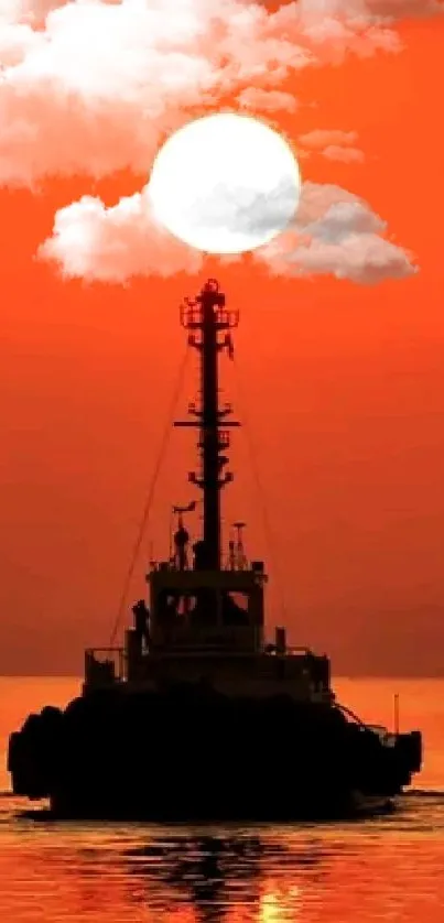 Silhouette of a ship against an orange sunset over the ocean.