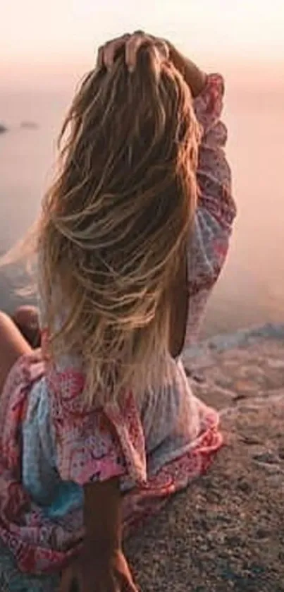 Woman enjoying serene sunset at beach.