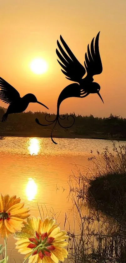 Sunset over lake with hummingbirds silhouetted against the orange sky.