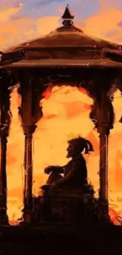 Silhouette of a figure in ornate structure against a vibrant sunset sky.