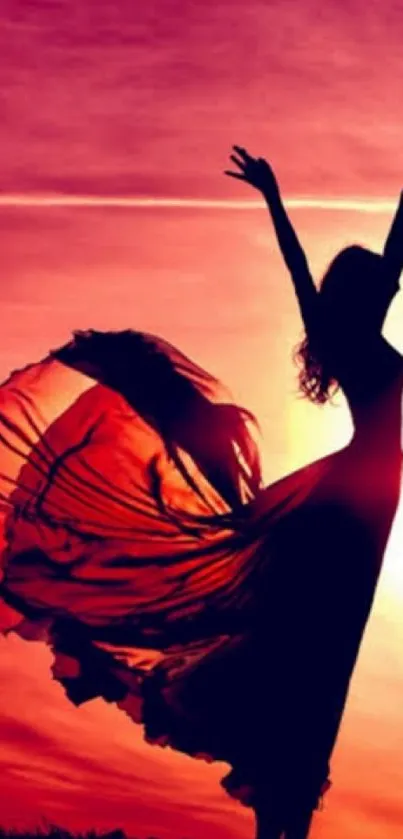 Silhouette of a woman dancing at sunset with flowing dress.