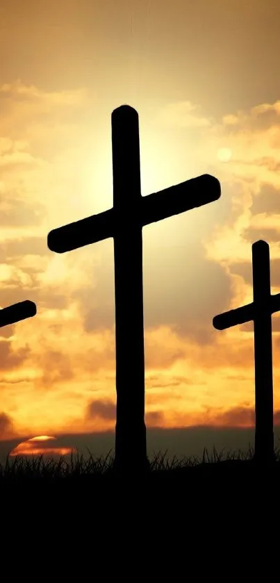 Silhouetted crosses against a vibrant sunset sky.