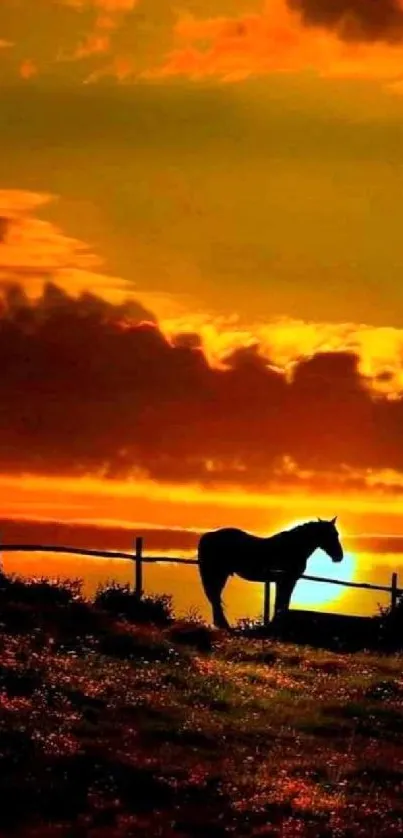 Silhouette of a horse at sunset on a scenic hilltop.