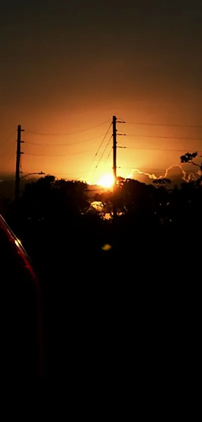 Silhouetted sunset with glowing sky and horizon.