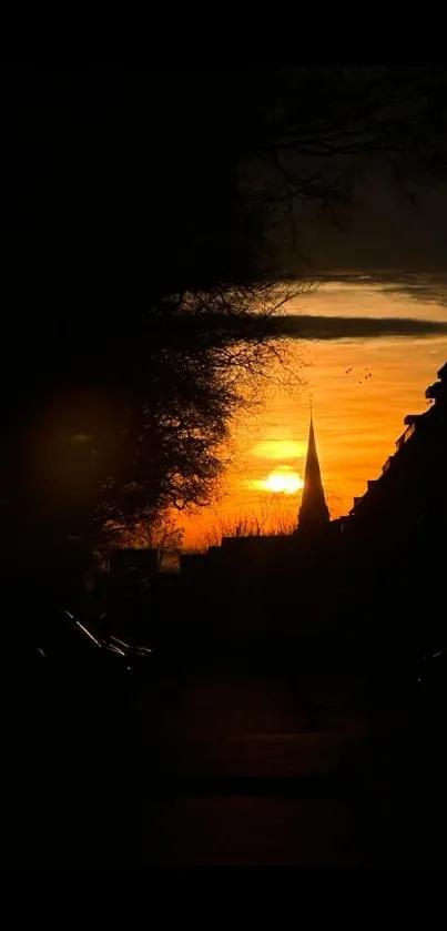 Mobile wallpaper of a vibrant sunset silhouette over a city skyline.