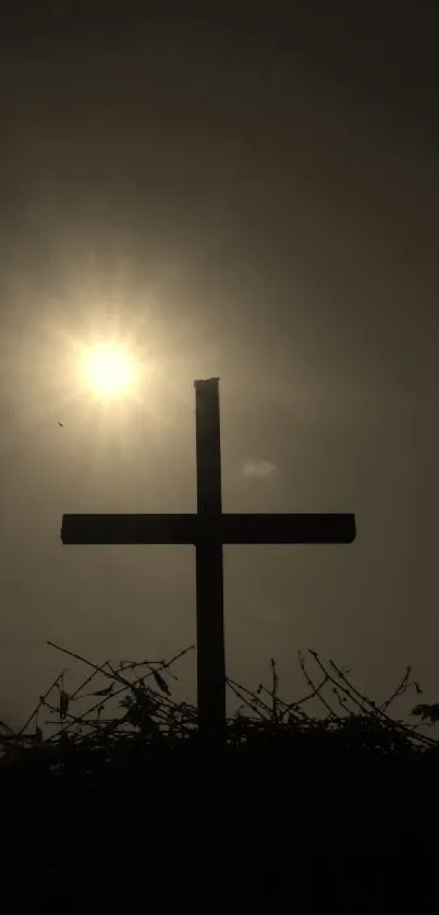 Silhouette of a cross against sunset sky, capturing serene spiritual beauty.