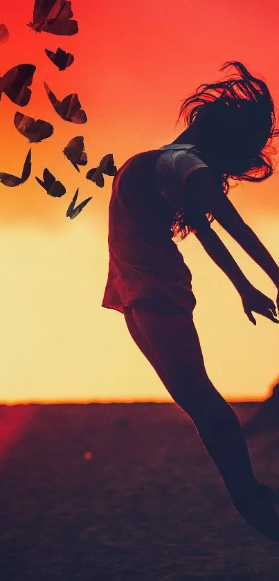 Silhouette of a girl leaping with butterflies against a sunset background.