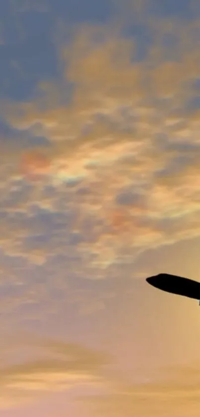 Silhouette of airplane against a colorful sunset sky and clouds on mobile wallpaper.